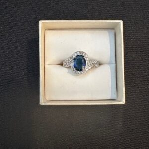 Ring002 925 Sterling Silver and created blue stone.  Size 5